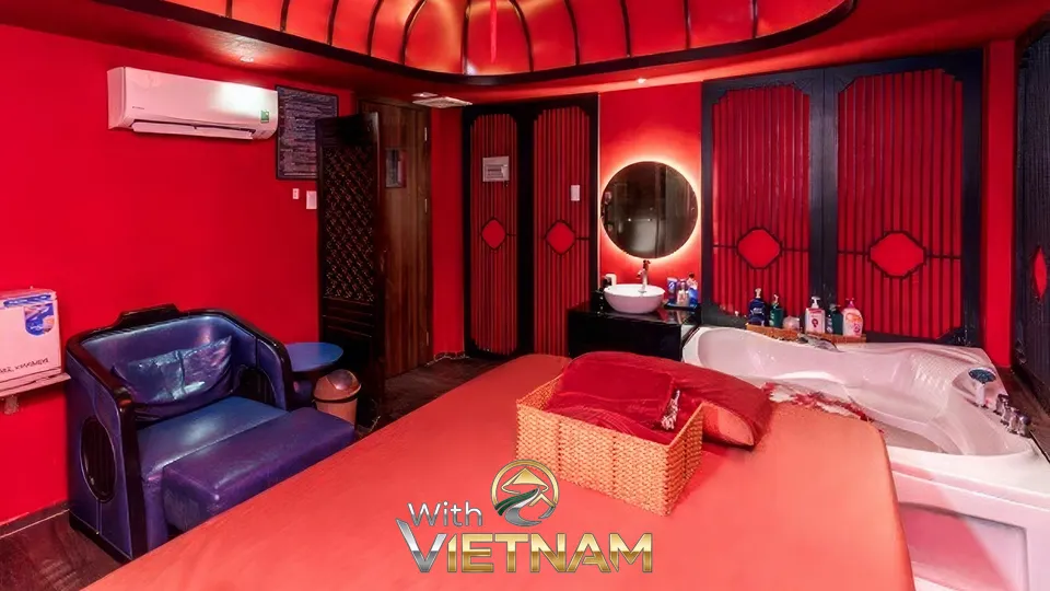 마사지 베드와 욕조가 있는 붉은색 방