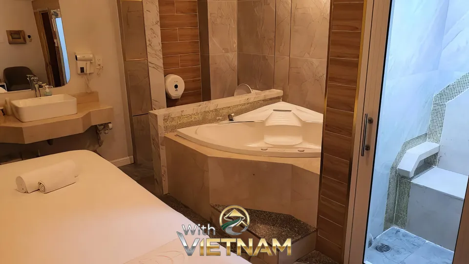 코너 욕조와 마사지 침대가 있는 방