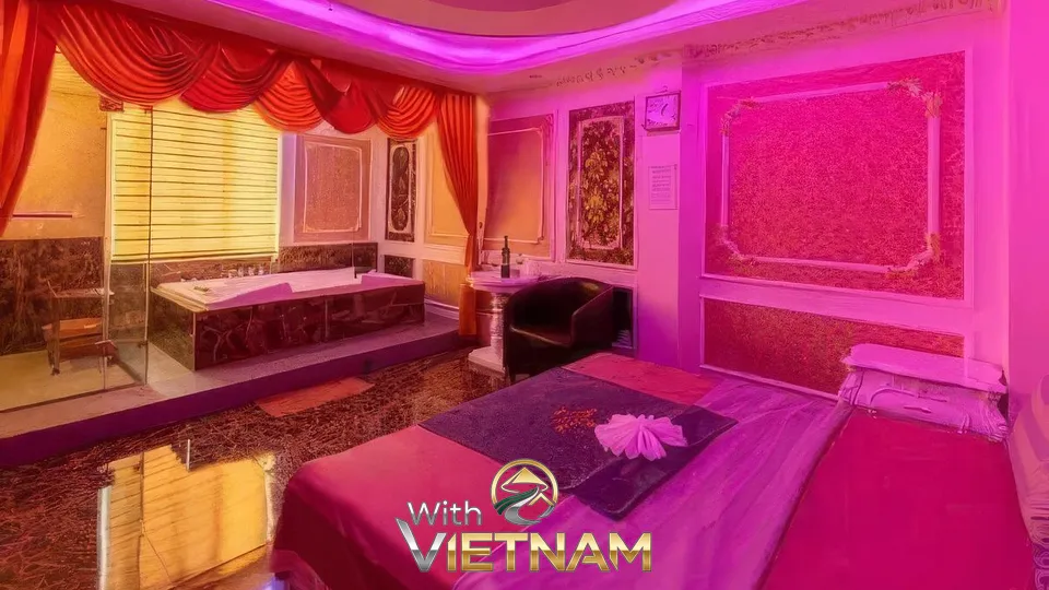 핑크색 조명의 침대와 욕조가 있는 방